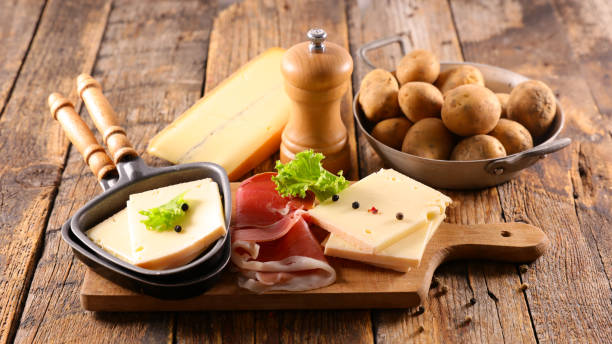 istock raclette cheese with meat and potato 1281219348