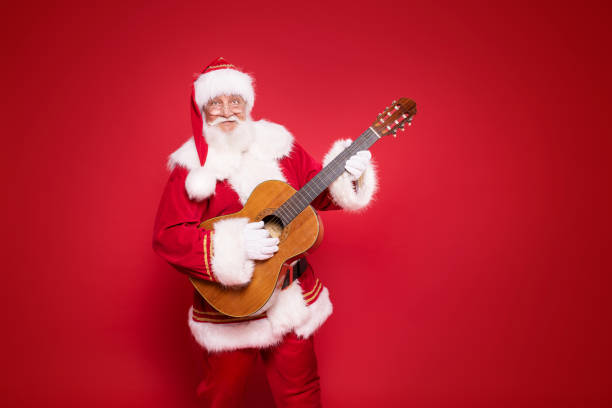 istock Santa Claus playing on guitar 1281219355