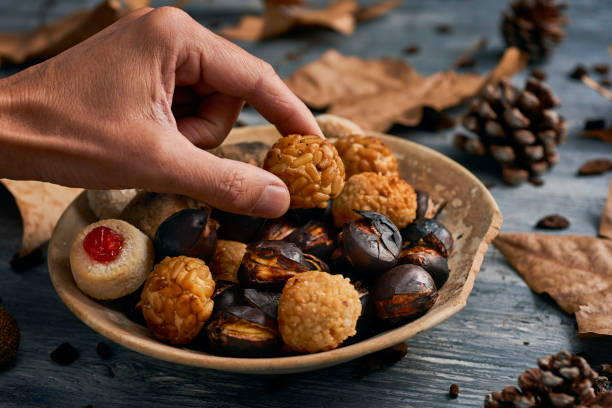 istock taking a panellet, typical confection of Catalonia 1281220666