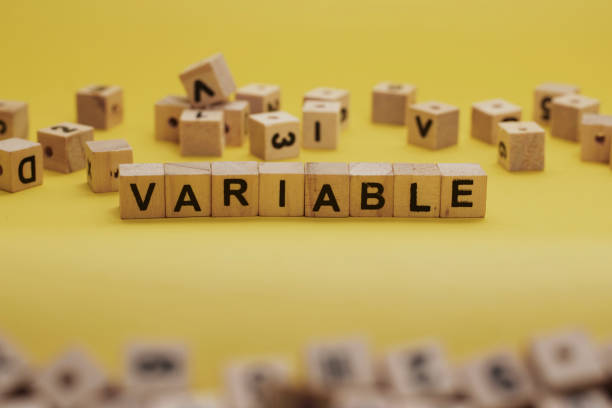 istock VARIABLE Word Written In Wooden Cube With Yellow Background 1281222023