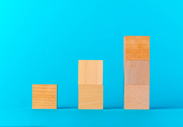istock Toy wooden blocks on blue background front view 1281222369