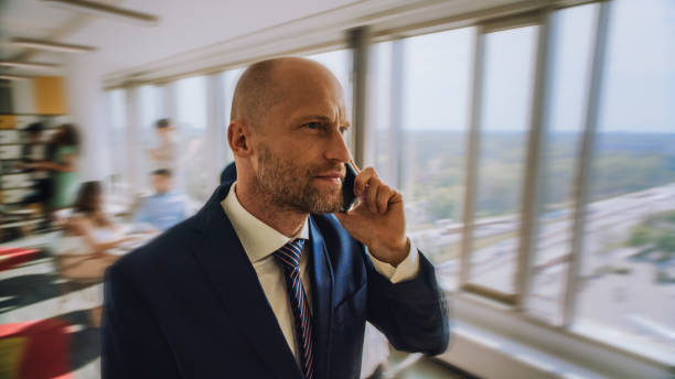 istock Busy day at office. Elegant businessman making important call 1281224860