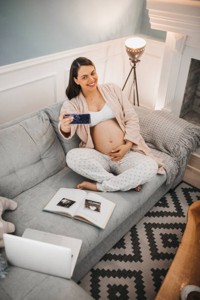 istock A pregnant woman prepares a book 1281227110
