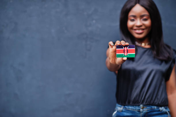 istock African woman hold small Kenya flag in hands. 1281227231