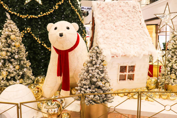 istock figures of teddy bears around the Christmas tree 1281227616