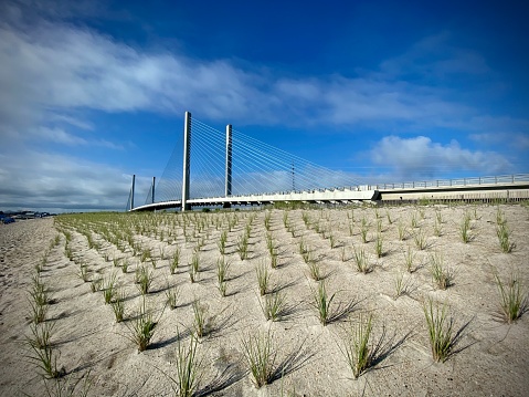 Sand dunes in foreground at the Indian River Inlet Bridge