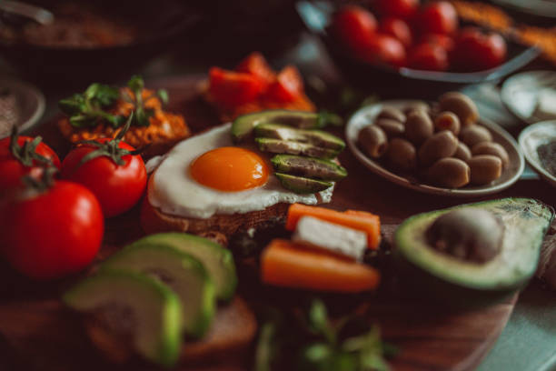 istock Making fried egg, avocado and cherry tomato toasts at home 1281230973