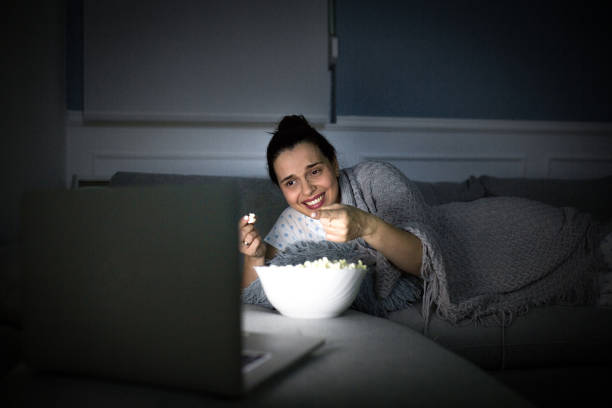 istock Pregnant woman watching a comedy 1281232035