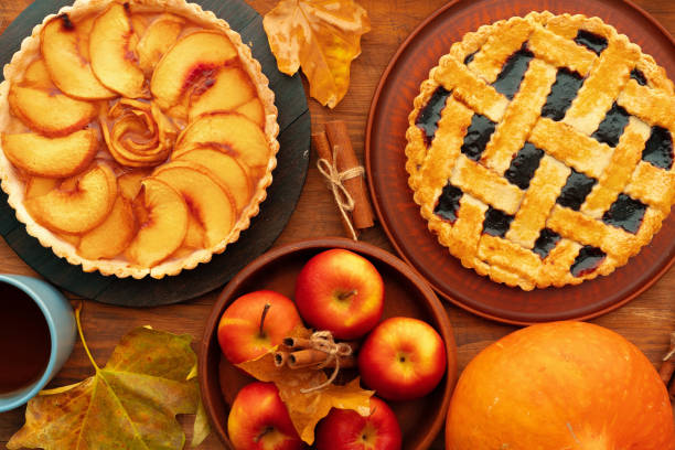 istock Thanksgiving berry and apple various pies on wooden surface, top view 1281232418