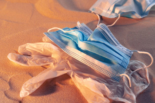 istock Protective facial mask on the natural outdoors beach background 1281232498