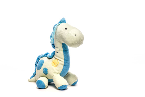 Toy dinosaur isolated on white background, soft fluffy toy