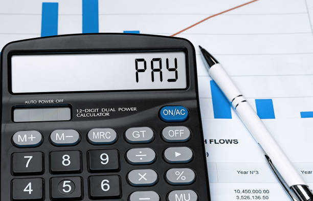 istock Calculator with the word PAY on the display 1281235621