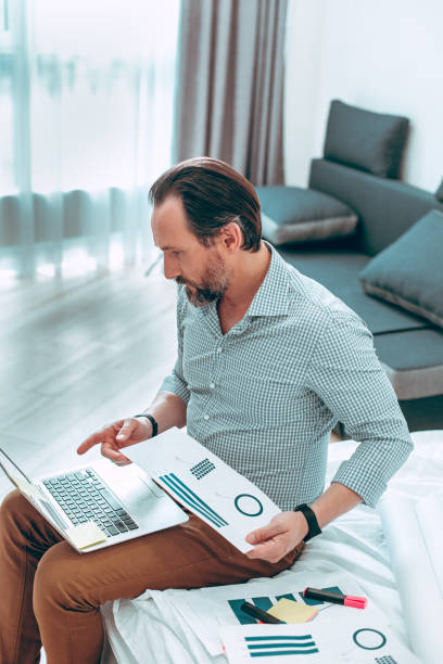 istock Boss conducting online conference with his employees 1281235652