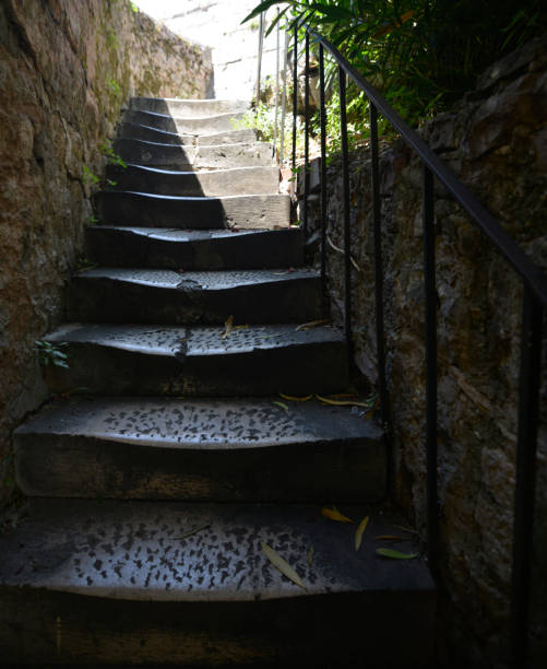istock Stairs in steep Mediterranean streets paved with stone 1281235714