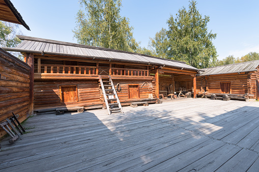 Taltsy, Irkutsk region / Russia - August 24, 2020: Architectural and Ethnographic Museum. Wooden courtyard of an old Siberian village.