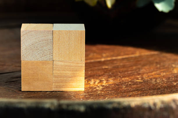 groupped wooden square blocks on dark wooden table - groupped imagens e fotografias de stock