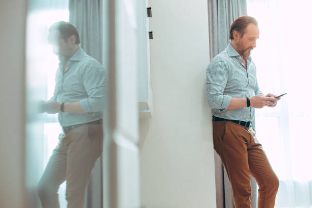 istock Contented user of the modern gadget at home alone 1281237079