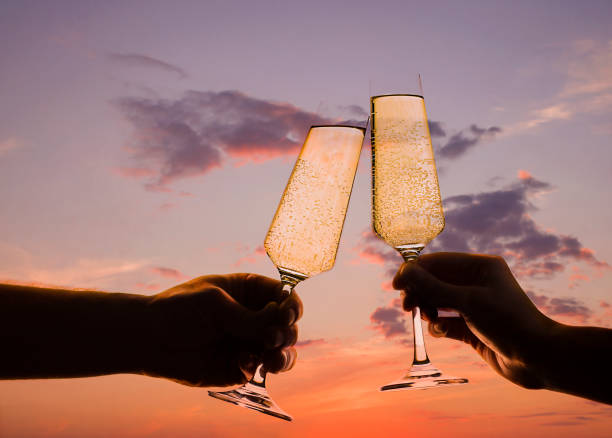 istock hands are holding glasses of champagne 1281237136