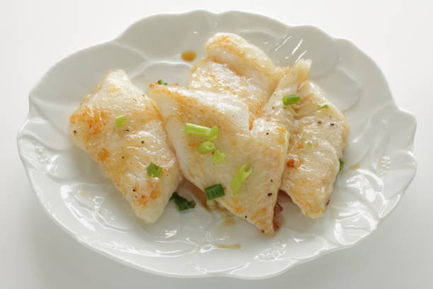 istock Pan fried flat fish fillet served with spring onion 1281238704