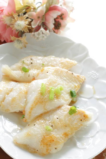 istock Pan fried flat fish fillet served with spring onion 1281238782