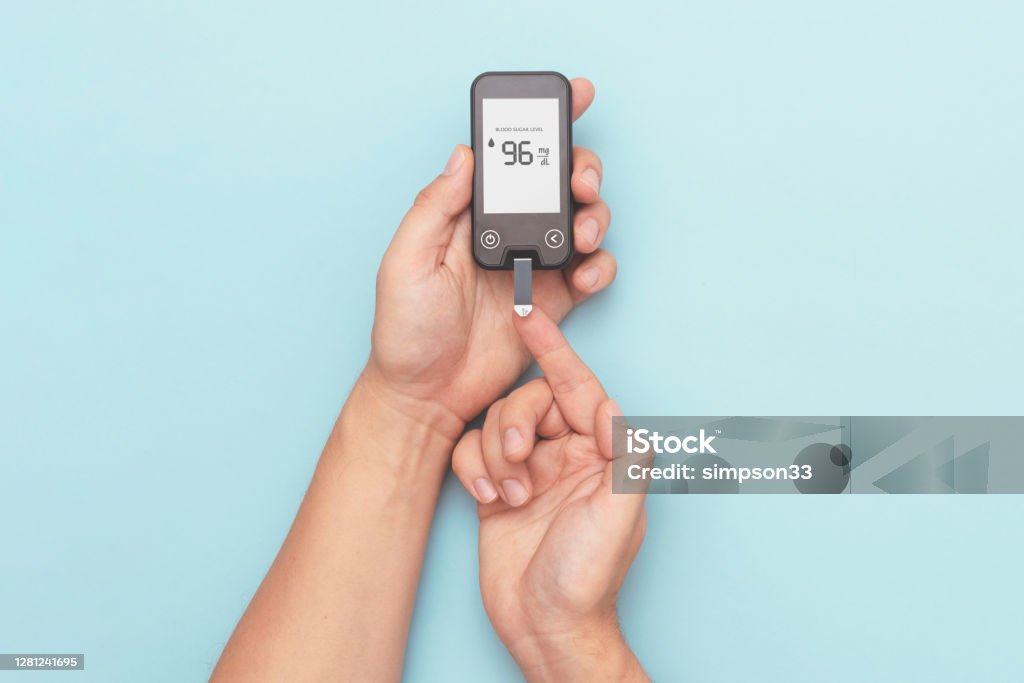 Man Using Glucometer Man Using Glucometer Checking Blood Sugar Level Stock Photo - Download ...