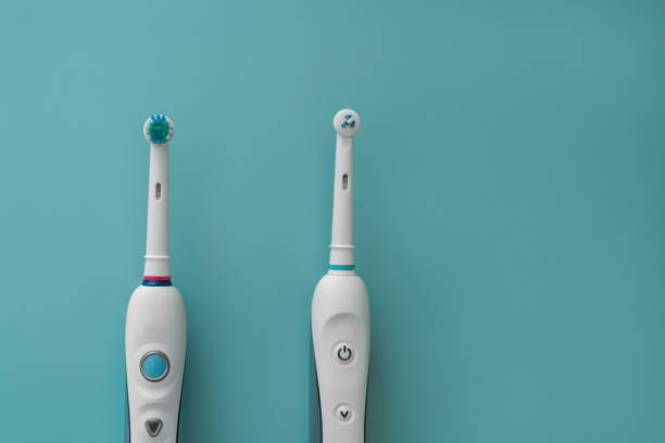 Modern rechargeable sonic or electric toothbrush set with charger