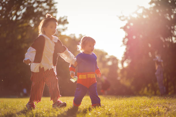 istock Brother and sister in the park. 1281243546