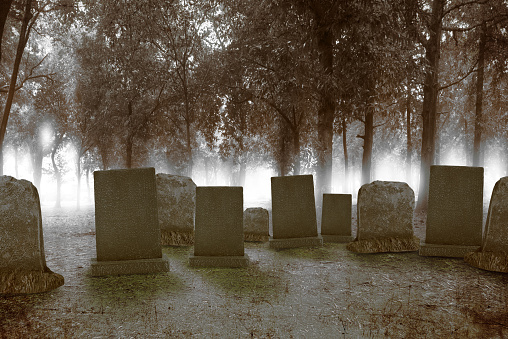 Broken gravestones in a suburban cemetery.