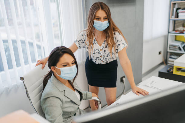 istock Female colleagues working together in office 1281247773