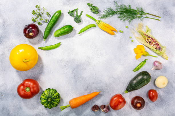 istock Fresh select seasonal vegetables on light textured backdrop,  top view 1281248709