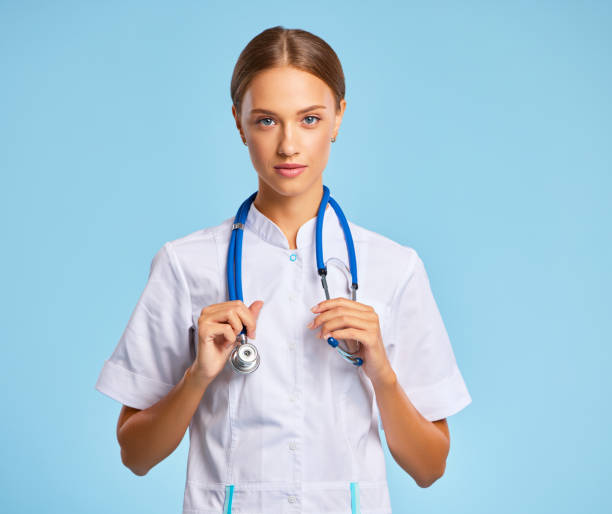 istock friendly doctor nurse in a   uniform smiles in isolation against 1281249056