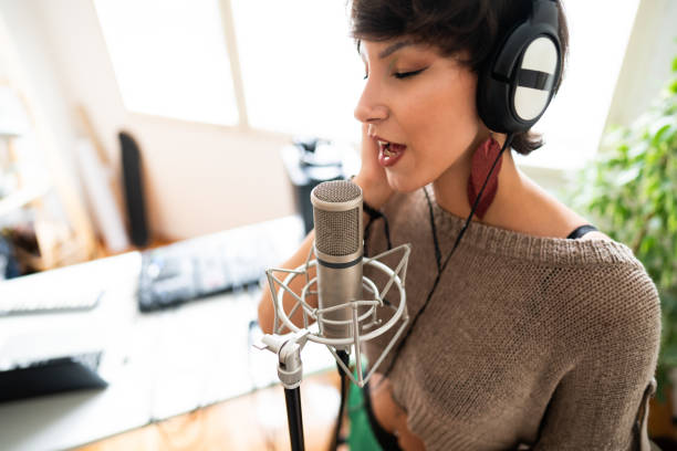 istock Caucasian, female singer singing eyes closed into the microphone 1281250004