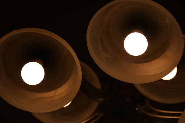 istock starry effects of the bulbs in a modern chandelier on the wall with blue light effect in the night 1281250310