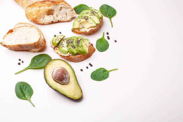 istock Bruschetta with avocado and baguette on a white table. Morning breakfast 1281251427