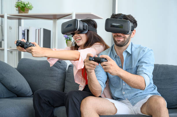 istock Couple lovers enjoy  playing VR game together at home. 1281252398