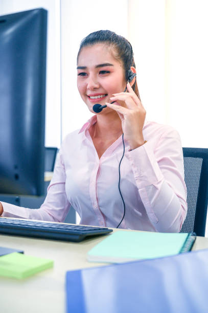 istock Young customer service women agent with headsets and computer working at office. 1281252578