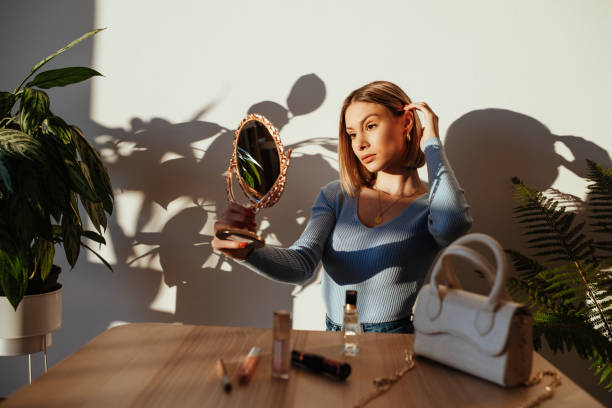 istock Gen Z woman at home, putting make up on before going on date 1281253389