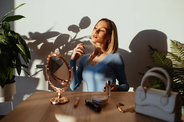 Gen Z woman at home, putting make up on before going on date