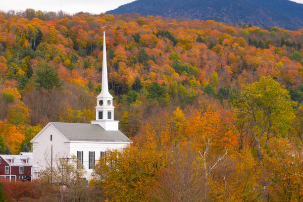 istock White church surrounded by fall foliage in Stowe Vermont 1281254270