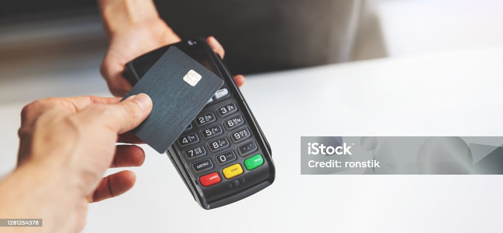 nfc contactless payment by credit card and pos terminal. copy space Credit Card Stock Photo