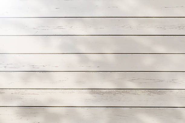istock White wood plank wall texture background with shadow and flare 1281257139
