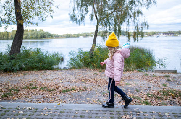 istock Little girl walks in the park. 1281260313