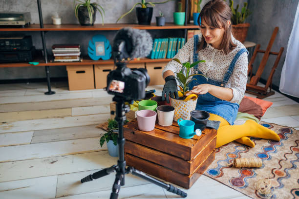 istock Charming young female botanist recording online tutorial about what you need to know about ficus maintenance 1281260336