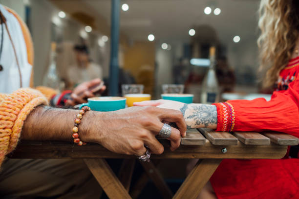 istock Couple Holding Hands Over a Coffee 1281261650