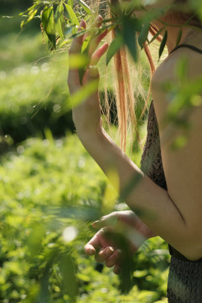 istock Young girl walking on meadow with sunset 1281261951