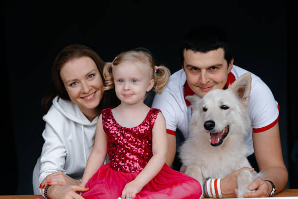istock A family with a small child and a dog. 1281262085