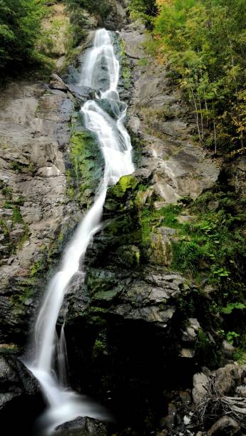 istock Beautiful waterfall in the mountains. 1281263011