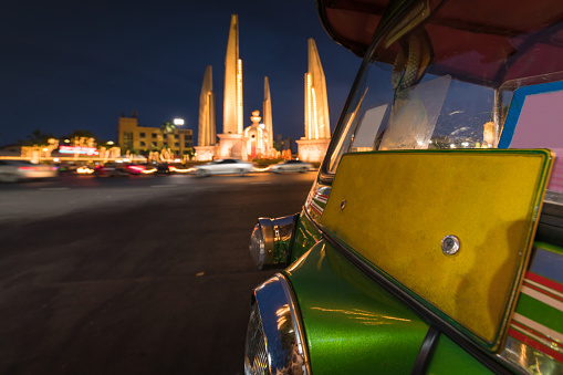 Democracy Monument at Twilight time. It is a public monument, and also one of local landmarks that photographers like to take, in the centre of Bangkok, capital of Thailand. This monument is commissioned in 1939 to commemorate the 1932 Siamese coup