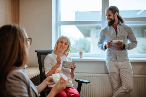 istock Business people having their lunch in office 1281271516
