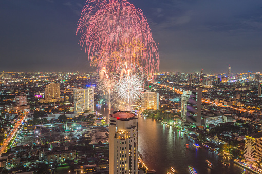 Firework display cityscape of Thai new year in Bangkok city at night, Thailand, Loy Krathong Festival